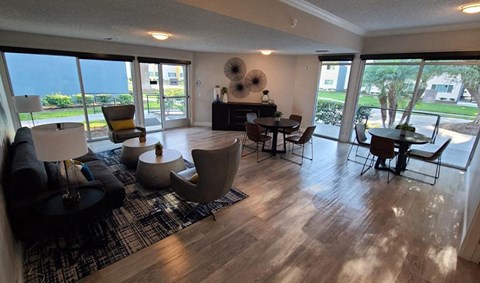 a living room filled with furniture and a large window